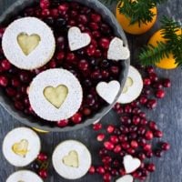 Holiday Maple Linzer Cookies. This delicious twist on a delicious cookie is the BEST! Bake a huge batch of these, they disappear fast! www.twopurplefigs.com