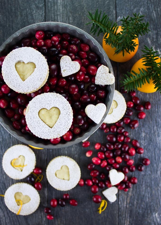 Holiday Maple Linzer Cookies. This delicious twist on a delicious cookie is the BEST! Bake a huge batch of these, they disappear fast! www.twopurplefigs.com