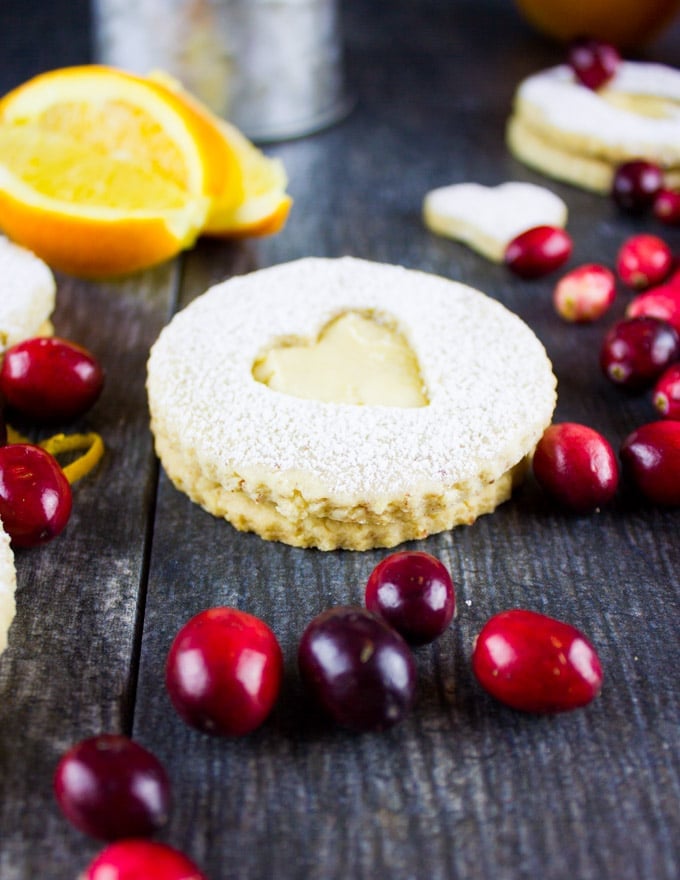 Holiday Maple Linzer Cookies. This delicious twist on a delicious cookie is the BEST! Bake a huge batch of these, they disappear fast! www.twopurplefigs.com