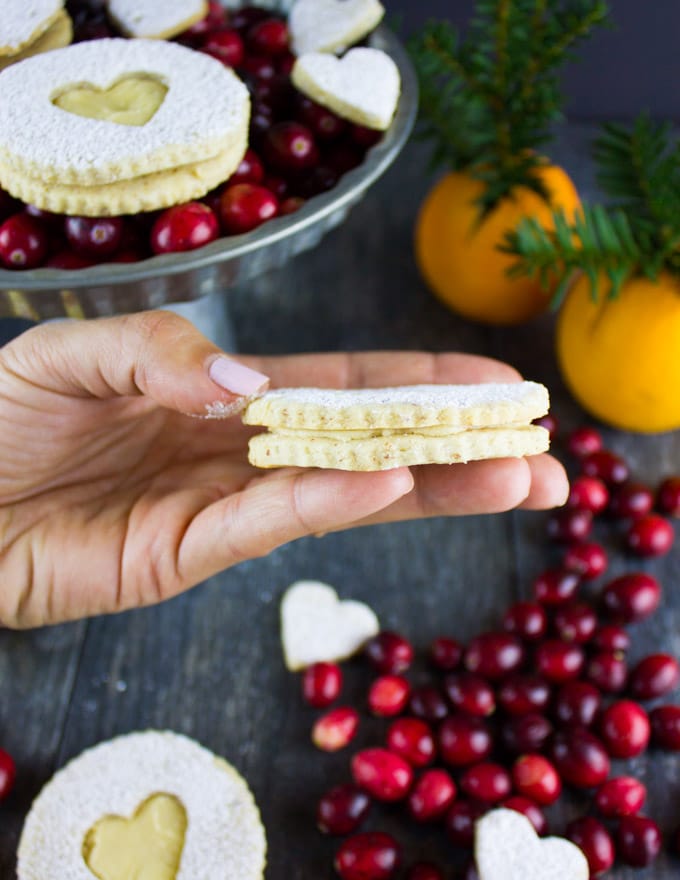 Holiday Maple Linzer Cookies. This delicious twist on a delicious cookie is the BEST! Bake a huge batch of these, they disappear fast! www.twopurplefigs.com