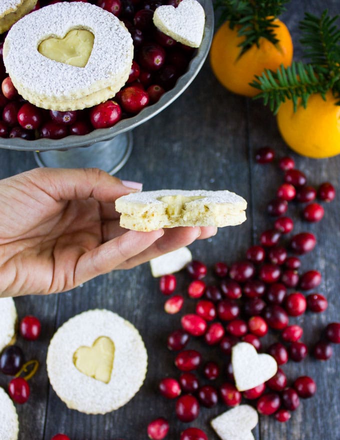 Holiday Maple Linzer Cookies. This delicious twist on a delicious cookie is the BEST! Bake a huge batch of these, they disappear fast! www.twopurplefigs.com