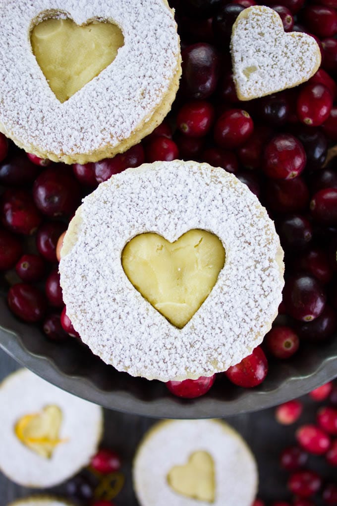 Holiday Maple Linzer Cookies. This delicious twist on a delicious cookie is the BEST! Bake a huge batch of these, they disappear fast! www.twopurplefigs.com