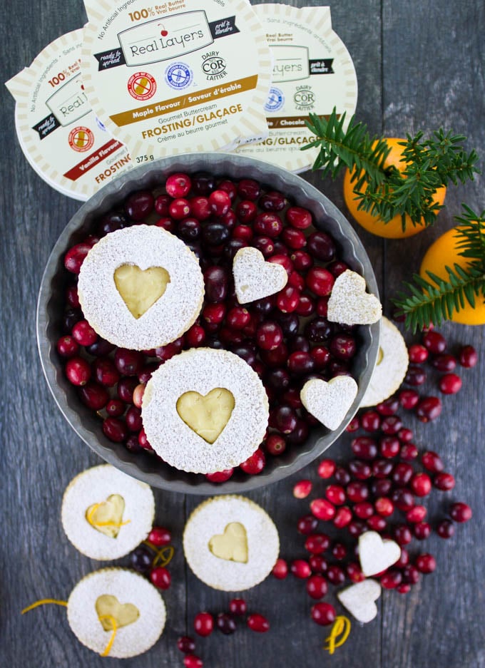 Holiday Maple Linzer Cookies. This delicious twist on a delicious cookie is the BEST! Bake a huge batch of these, they disappear fast! www.twopurplefigs.com