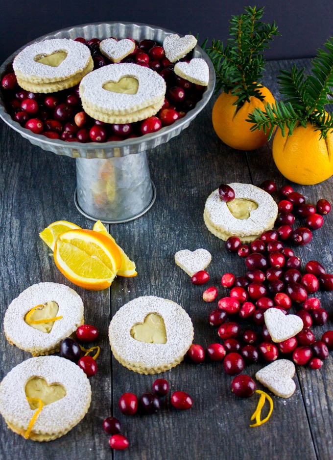 Holiday Maple Linzer Cookies. This delicious twist on a delicious cookie is the BEST! Bake a huge batch of these, they disappear fast! www.twopurplefigs.com