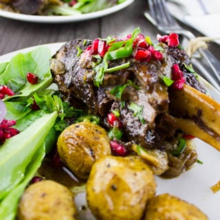 Pomegranate Roast Lamb Shanks on a plate