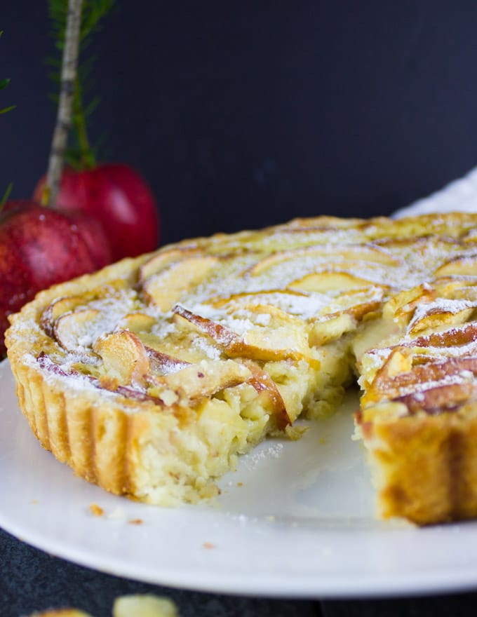 close up of Swiss Apple Tart with gala apples in the background