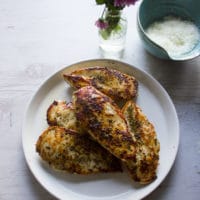 pan seared chicken breasts with a lovely golden crust on a white plate