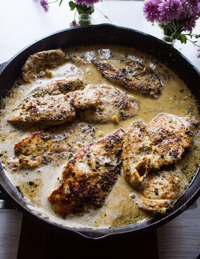 Chicken breasts added back to the walnut sauce for cooking