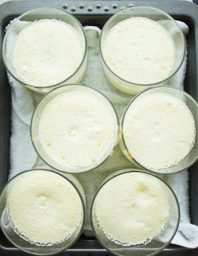 freshly baked individual mini lemon pudding cakes in a tray