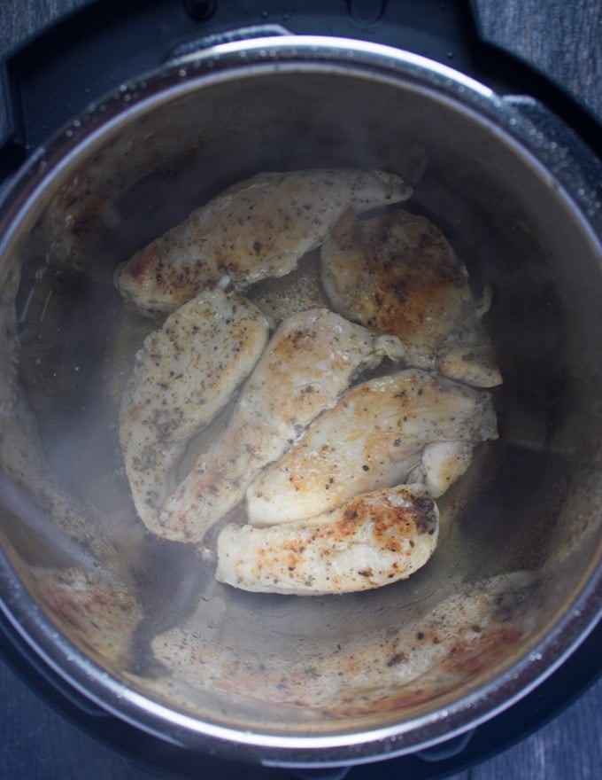 chicken breasts frying in an instant pot