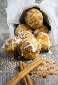 Baked Donut Holes with Cinnamon Sugar and Vanilla Glaze. The quickest most divine way to enjoy some donut comfort!