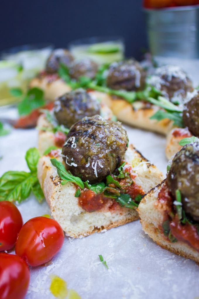 American Lamb Meatball Subs with marinara sauce and basil cut into bite-sized pieced