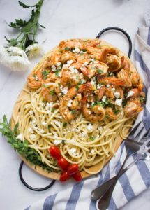 Quick Shrimp Pasta with Garlic Feta Sauce. 15 Minute pasta dish that's light, delicious, easy and loaded with a Mediterranean flare!