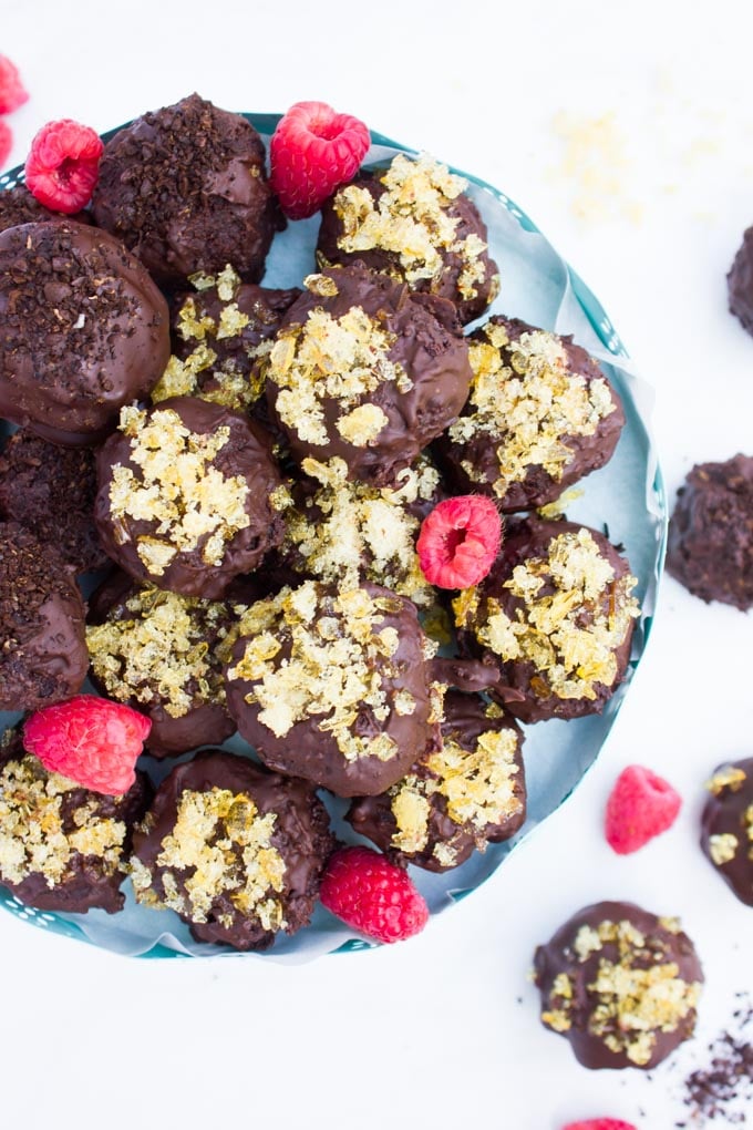 Chocolate Brownies Ball Dipped In Chocolate. Decadent fudgy brownies rolled and stuffed with a luscious chocolate truffle, then dipped in melted chooclate and topped with caramel bits. Need I say more!?