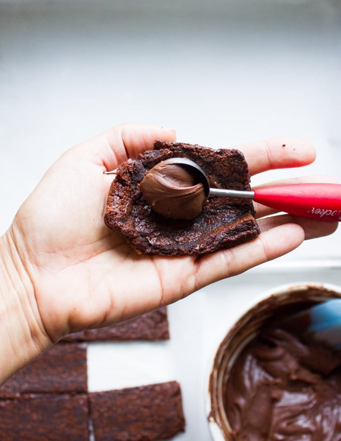 Chocolate Brownies Ball Dipped In Chocolate. Decadent fudgy brownies rolled and stuffed with a luscious chocolate truffle, then dipped in melted chooclate and topped with caramel bits. Need I say more!?