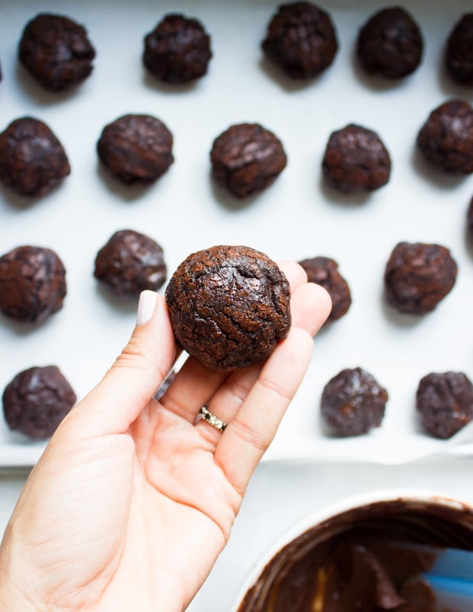 Chocolate Brownies Ball Dipped In Chocolate. Decadent fudgy brownies rolled and stuffed with a luscious chocolate truffle, then dipped in melted chooclate and topped with caramel bits. Need I say more!?