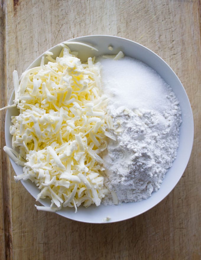 ingredients for pie crust in a white bowl