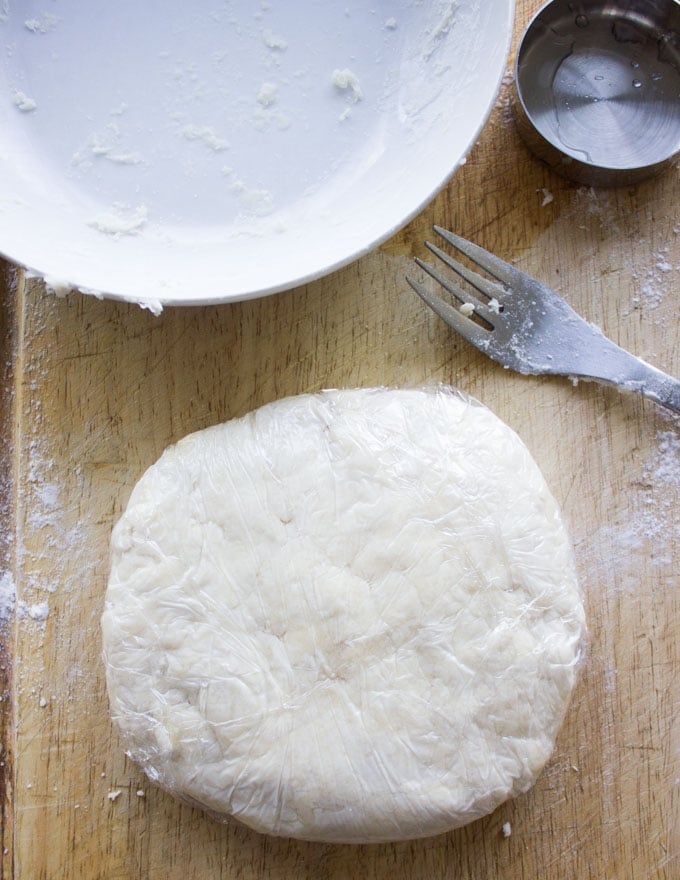 pie pastry disk wrapped in cling film ready to be chilled