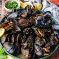 A large plate of perfectly cooked mussels
