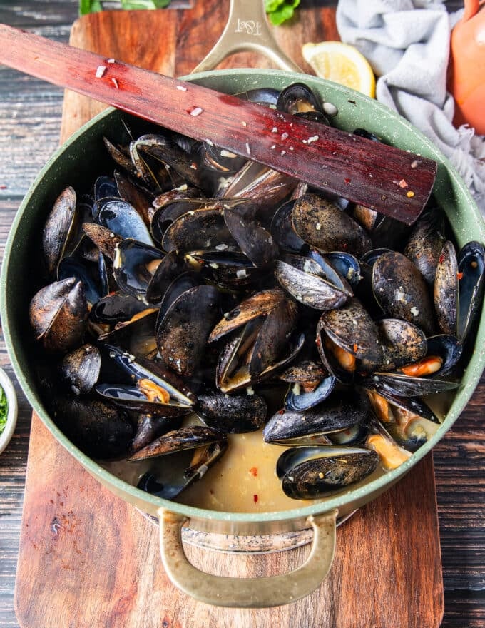 close up of the sauce and mussel juice formed in the pan