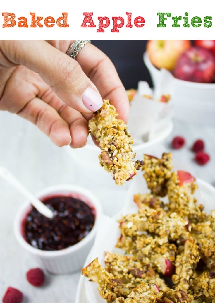 Baked Apple Fries with Raspberry Sauce ! These healthy granola-coated apple sticks are highly addictive. Every bite is a crunch of oats, seeds and nuts with a tender sweet baked apple inside. A healthy, fun snack your whole family will love! #snack, #easy, #healthy, #baked
