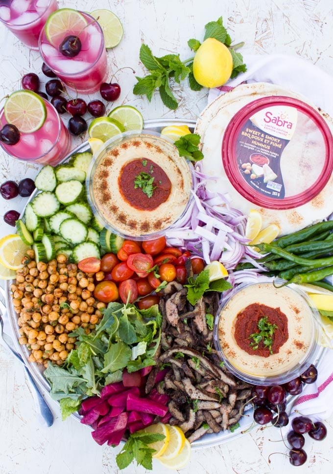 The sabra hummus on a platter of shawarrma