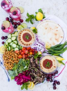 platter of shawarma , hummus and other ingredients