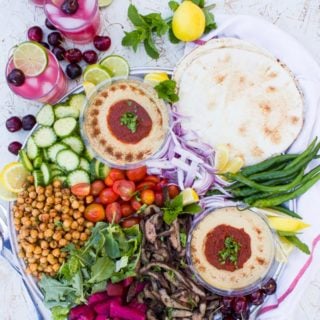 platter of shawarma , hummus and other ingredients