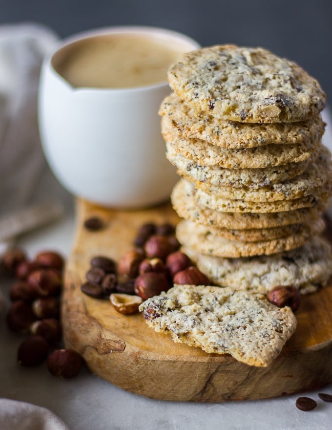 bitten off piece of thin coffee cookies showing the texture