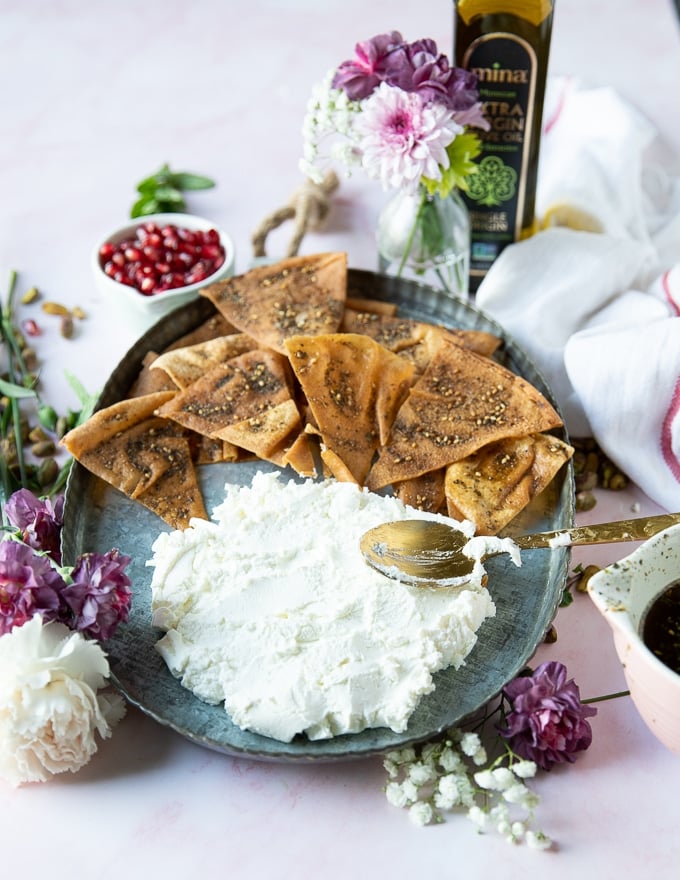 Finished labneh spread on a plate and ready for the topping