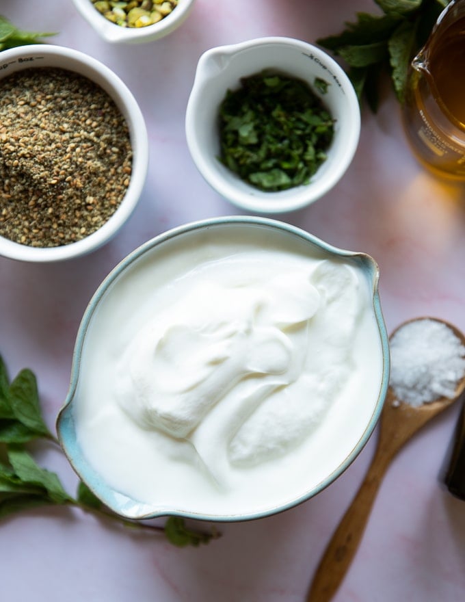 a big bowl of yogurt to be strained for labneh making