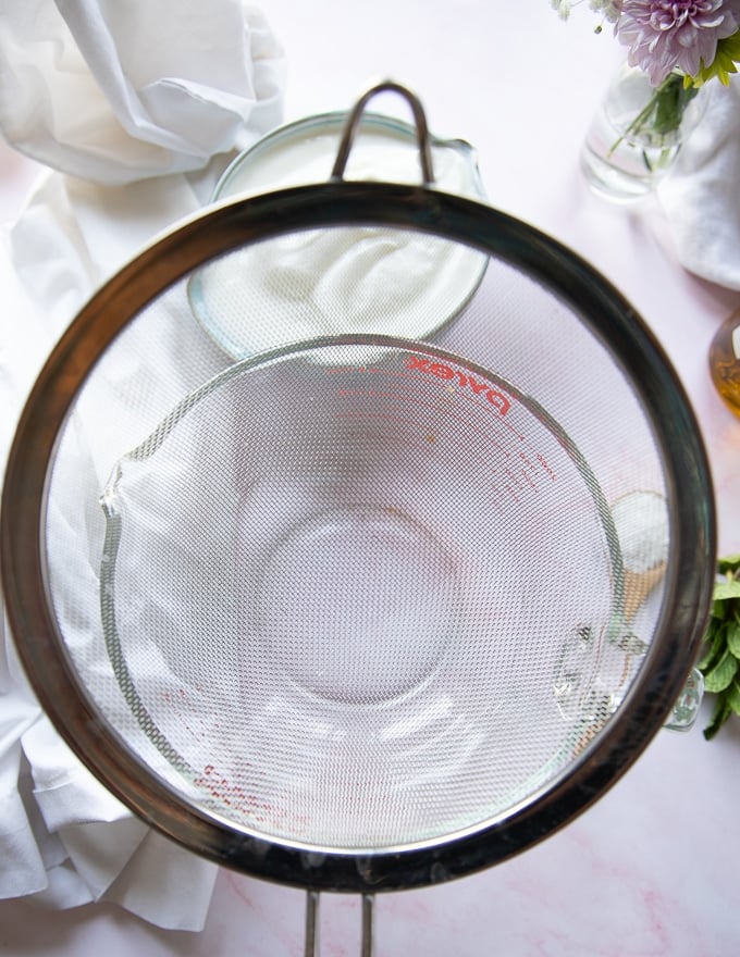 A sieve placed over a large bowl to help srain the yogurt to make labneh recipe