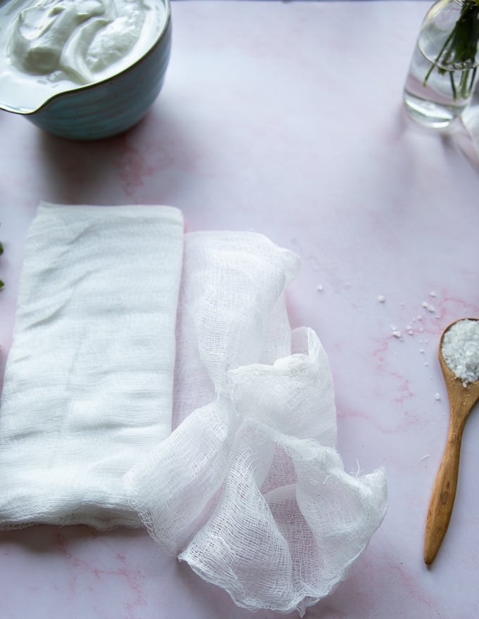 A cheese cloth on a marble board which is used to strain the yogurt and make labneh