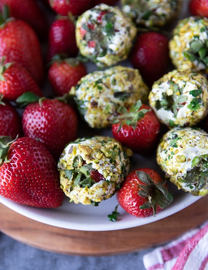 close up of a goat cheese appetizer with strawberries showing the textures