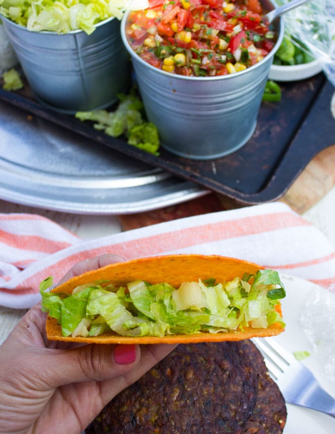 A taco shell with lettuce inside