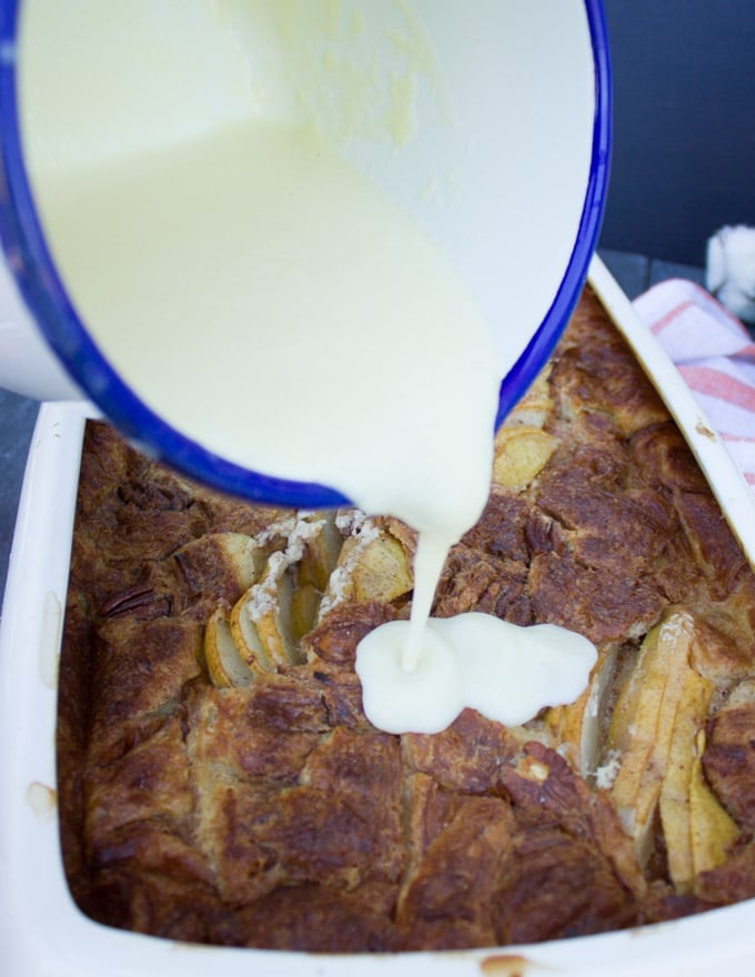 creme anglaise poured over the ready croissant pudding