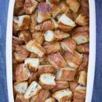 an oven safe dish filled with croissants cubes