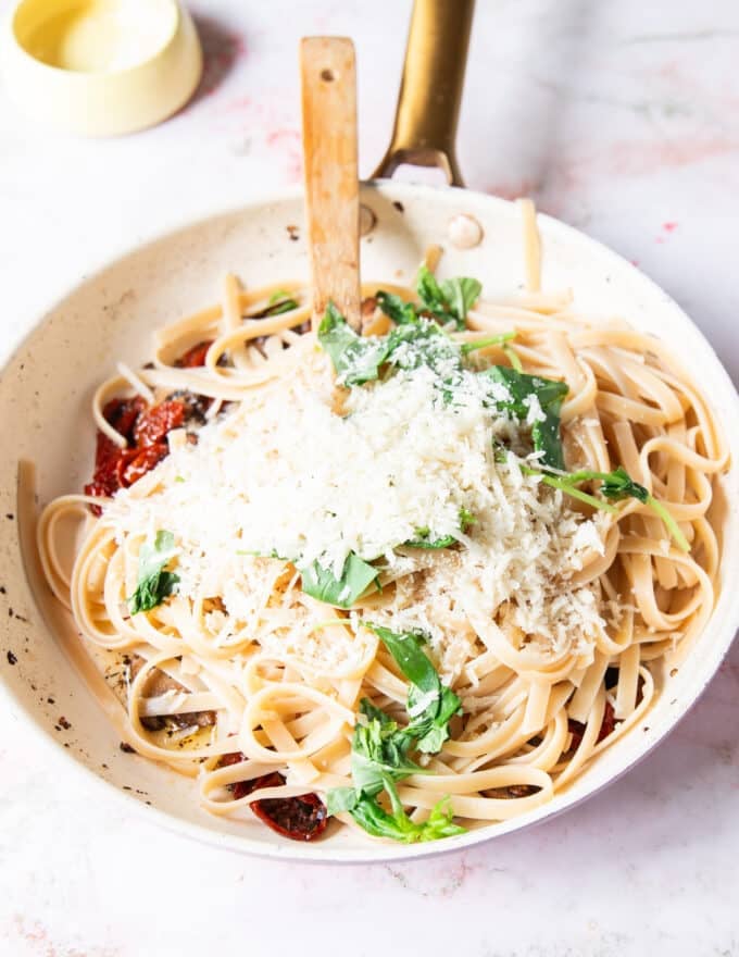 more parmesan cheese is added, and pasta water to make the creamy sauce