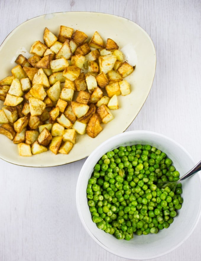 roasted cubed potatoes and cooked green peas