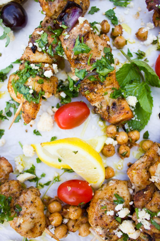 Chicken skewers with spicy chickpeas and tomatoes