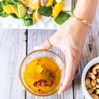 Orange dressing ingredients in a bowl