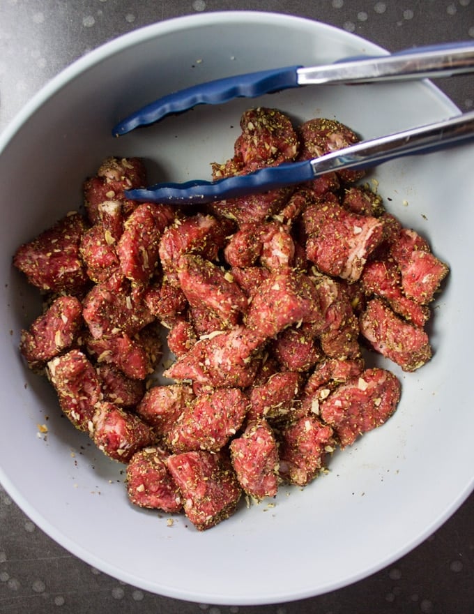 A bowl with lamb chunks seasoned and ready to cook for dippers