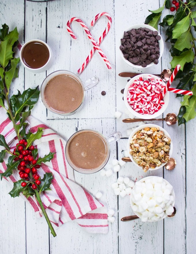 top view of all the hot chocolate poured in to cups and the toppings on the side