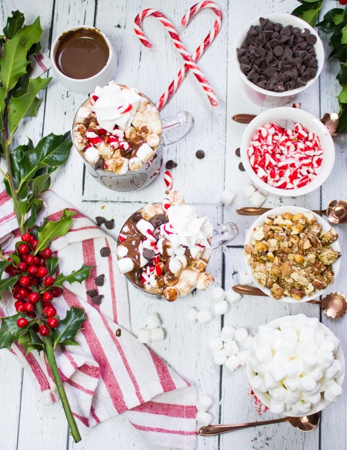 Top view of hot chocolate bar toppings and the perfect homemade hot chocolate cups