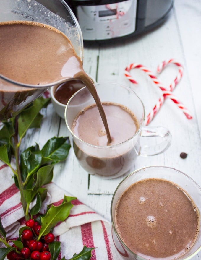 Pouring the ready hot chocolate in cups