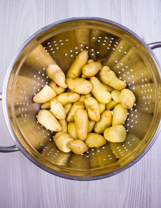 Potatoes washed and drained in a colander