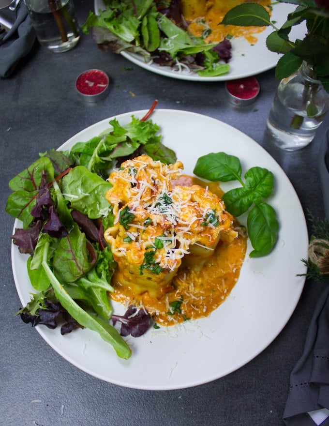  A finished lasagna roll ups plate with salad on the side