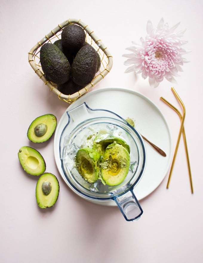 All the avocado smoothie recipe ingredients are placed in a blender