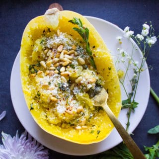 One fork twisting inside the spaghetti squash to show gather the strands of spaghetti squash recipe