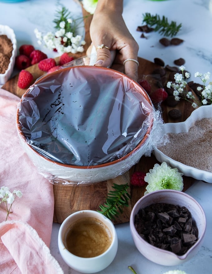 the chocolate truffles mixture covered in plastic wrap